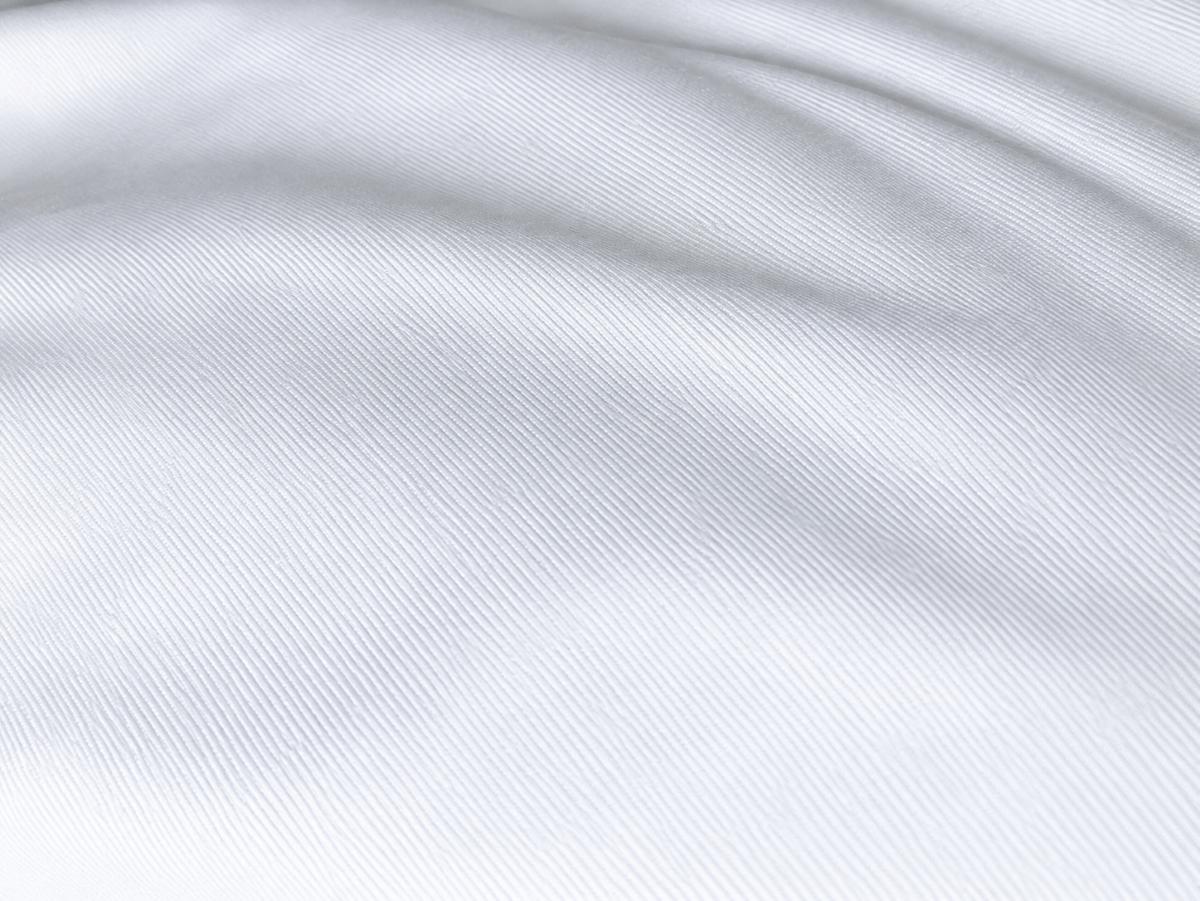 TLS Performance Interlock Fabric Toplevel Sportswear White Performance Interlock fabric showing smooth knit texture